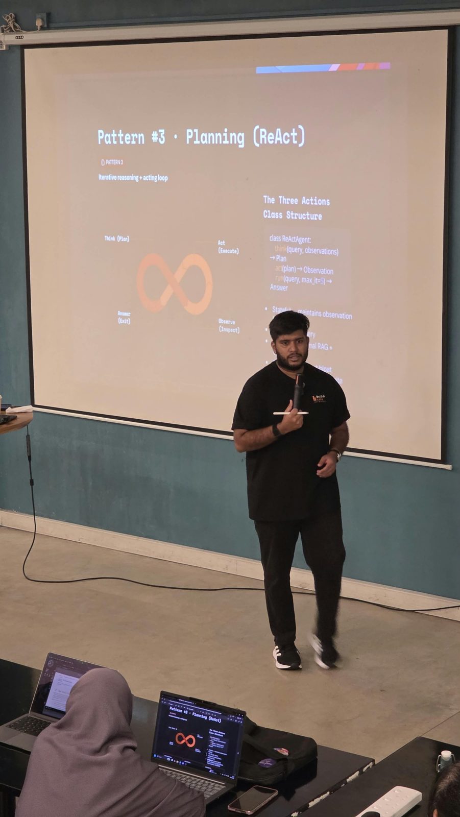 Isuru teaching the ReAct planning pattern on stage