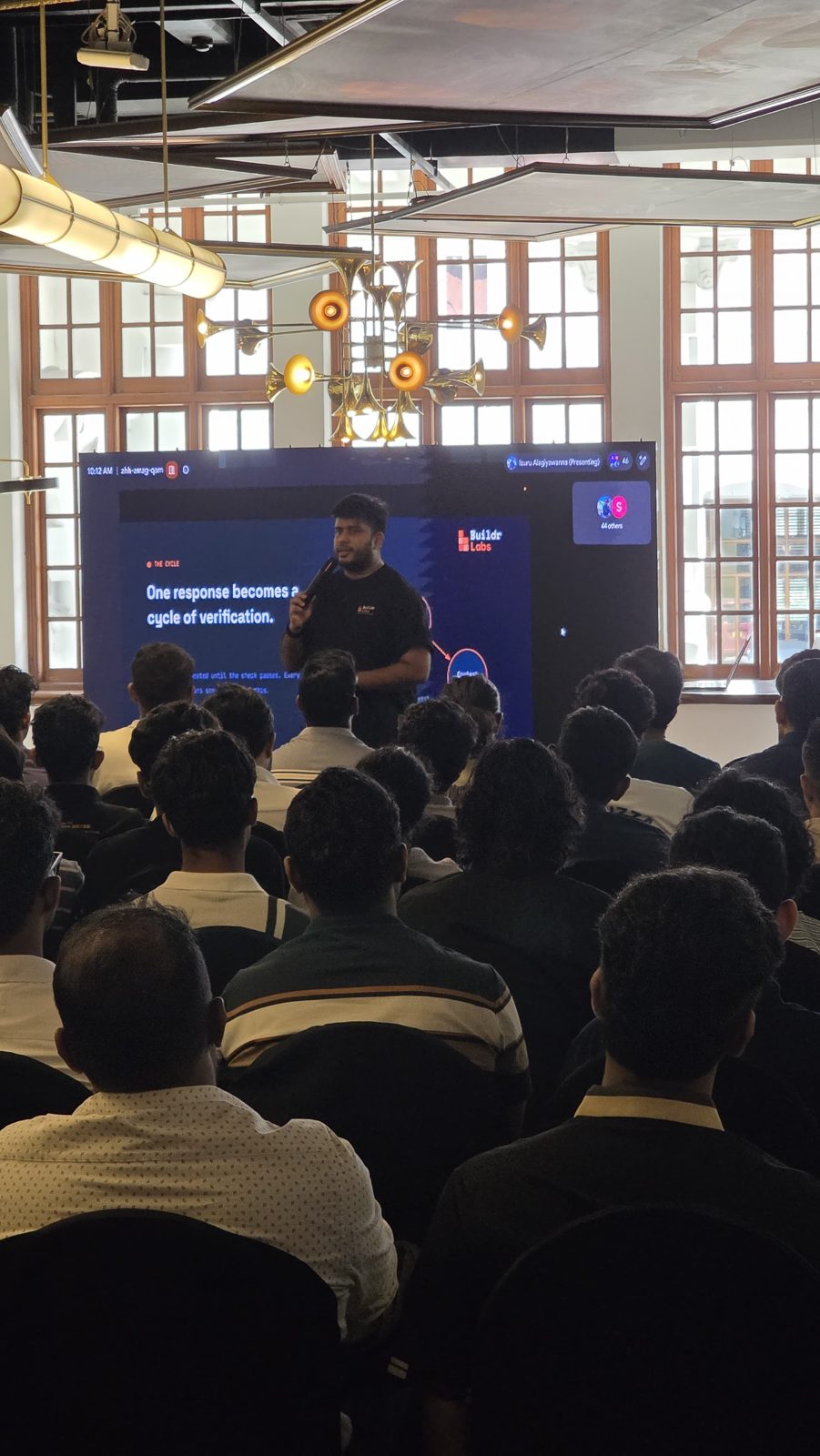 Isuru teaching a packed room of engineers from the front screen